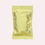 JONES + CO Almond Caramel Crunch chocolate bar with astragalus in a light green wrapper with gold foil detailing.
