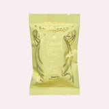 JONES + CO Almond Caramel Crunch chocolate bar with astragalus in a light green wrapper with gold foil detailing.