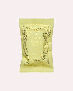 JONES + CO Almond Caramel Crunch chocolate bar with astragalus in a light green wrapper with gold foil detailing.