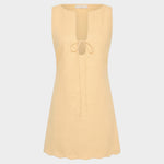JONES + CO Alondra mini dress in daffodil yellow with a sleeveless design, deep slit neckline, and tie detail.