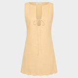 JONES + CO Alondra mini dress in daffodil yellow with a sleeveless design, deep slit neckline, and tie detail.
