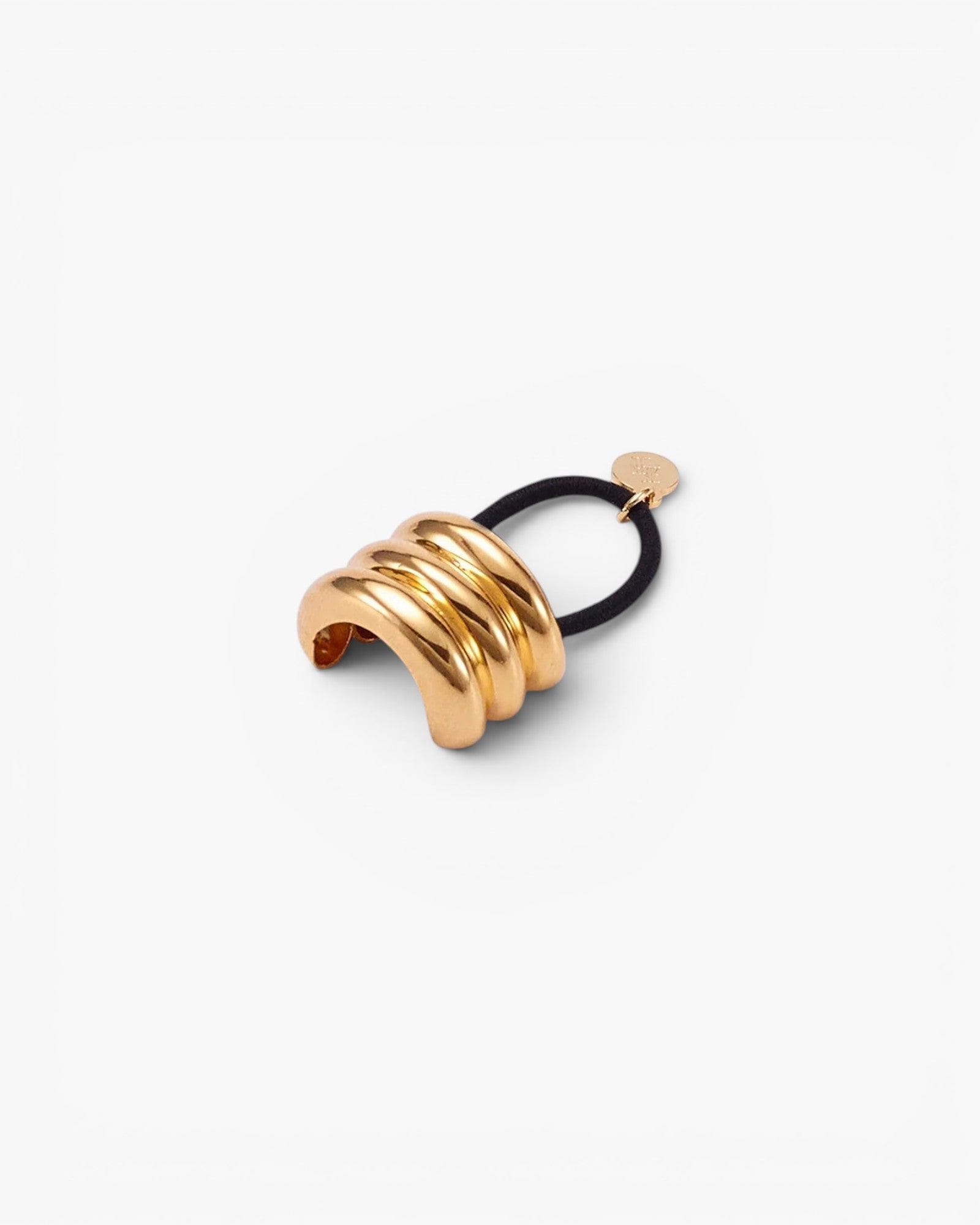 JONES + CO Anya Mini Pony Cuff in gold with a black elastic band for braids and ponytails.