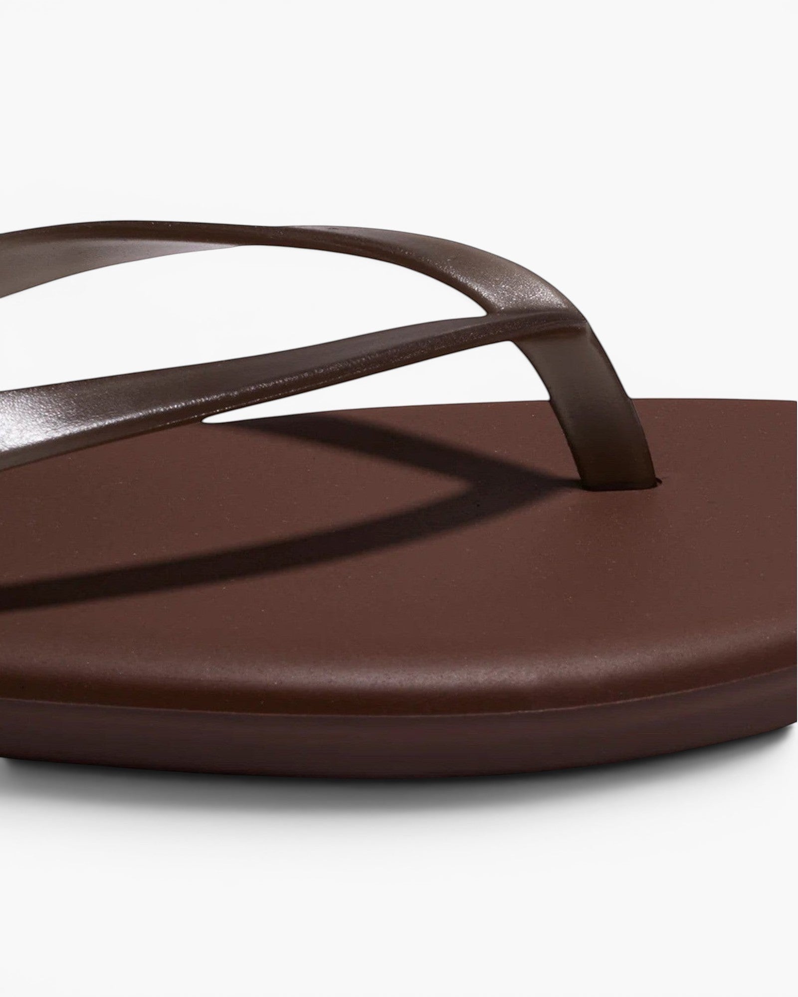 JONES + CO brown waterproof Aqua Lily flip-flop sandal with a minimal design for beach and summer wear.