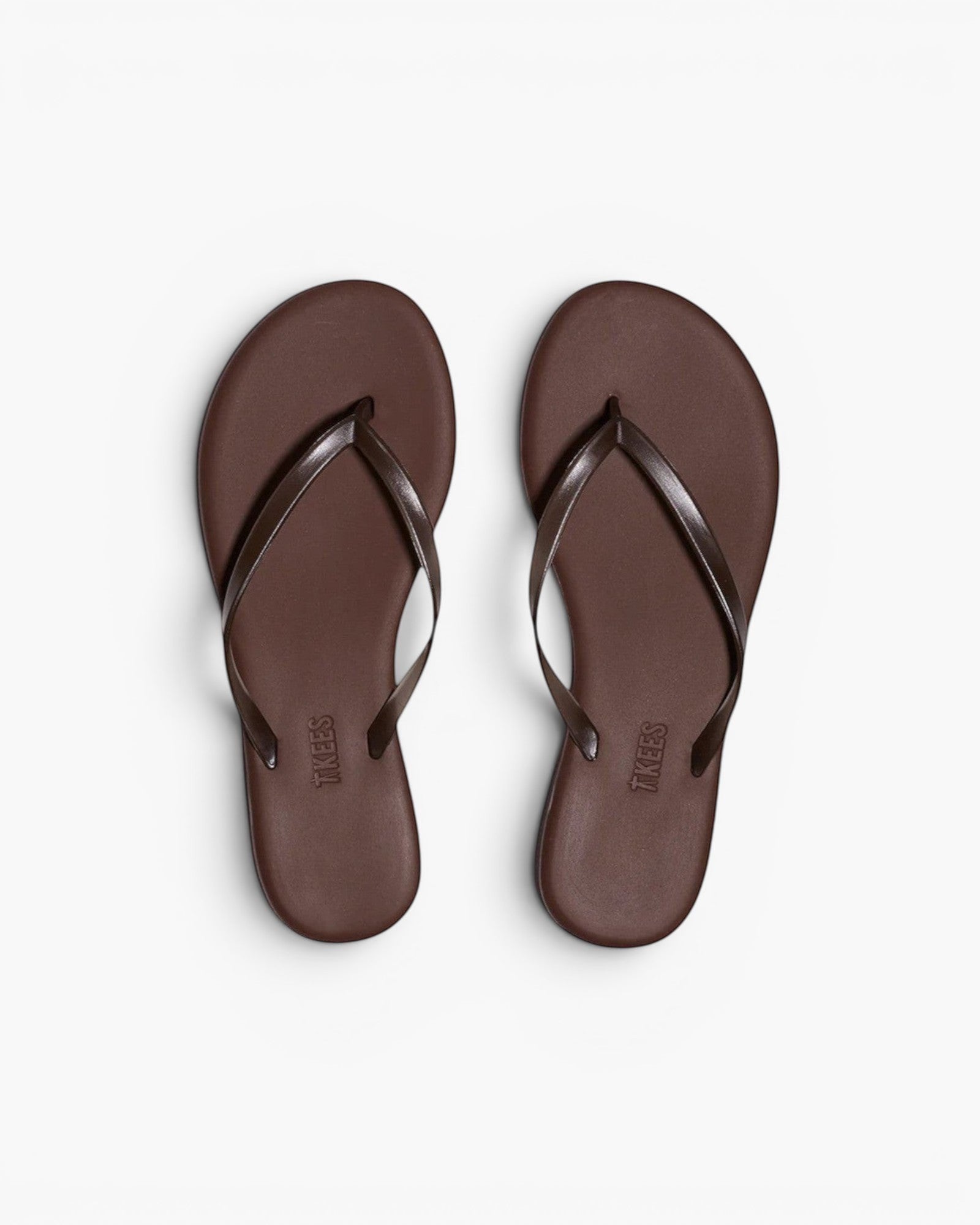 JONES + CO Aqua Lily minimal waterproof brown flip-flop sandals for beach and summer wear.