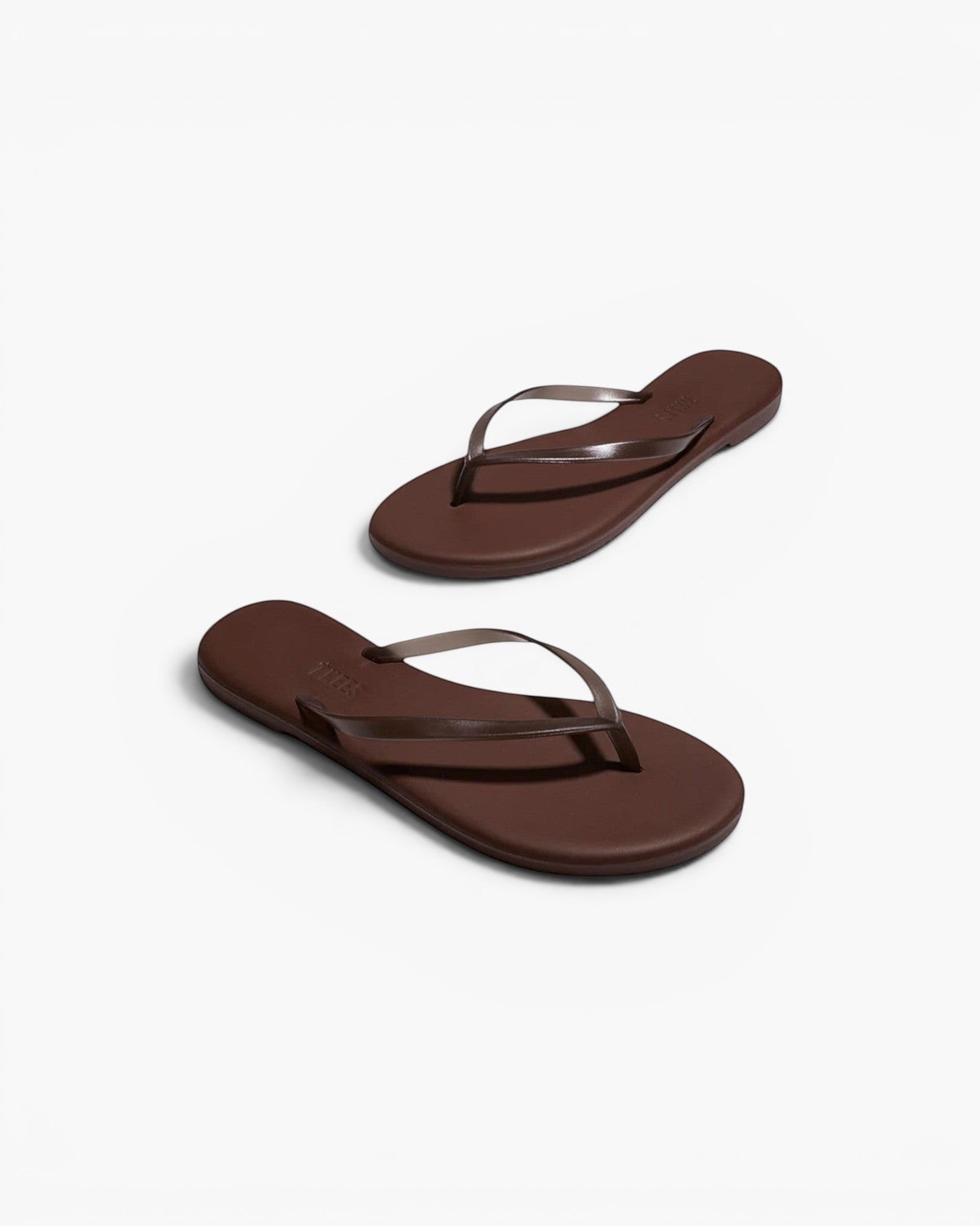 JONES + CO Aqua Lily waterproof brown flip-flop sandals with a minimal design for beach and summer wear.