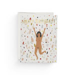 JONES + CO Birthday Suit greeting card featuring a joyful illustrated woman on a colorful confetti background.