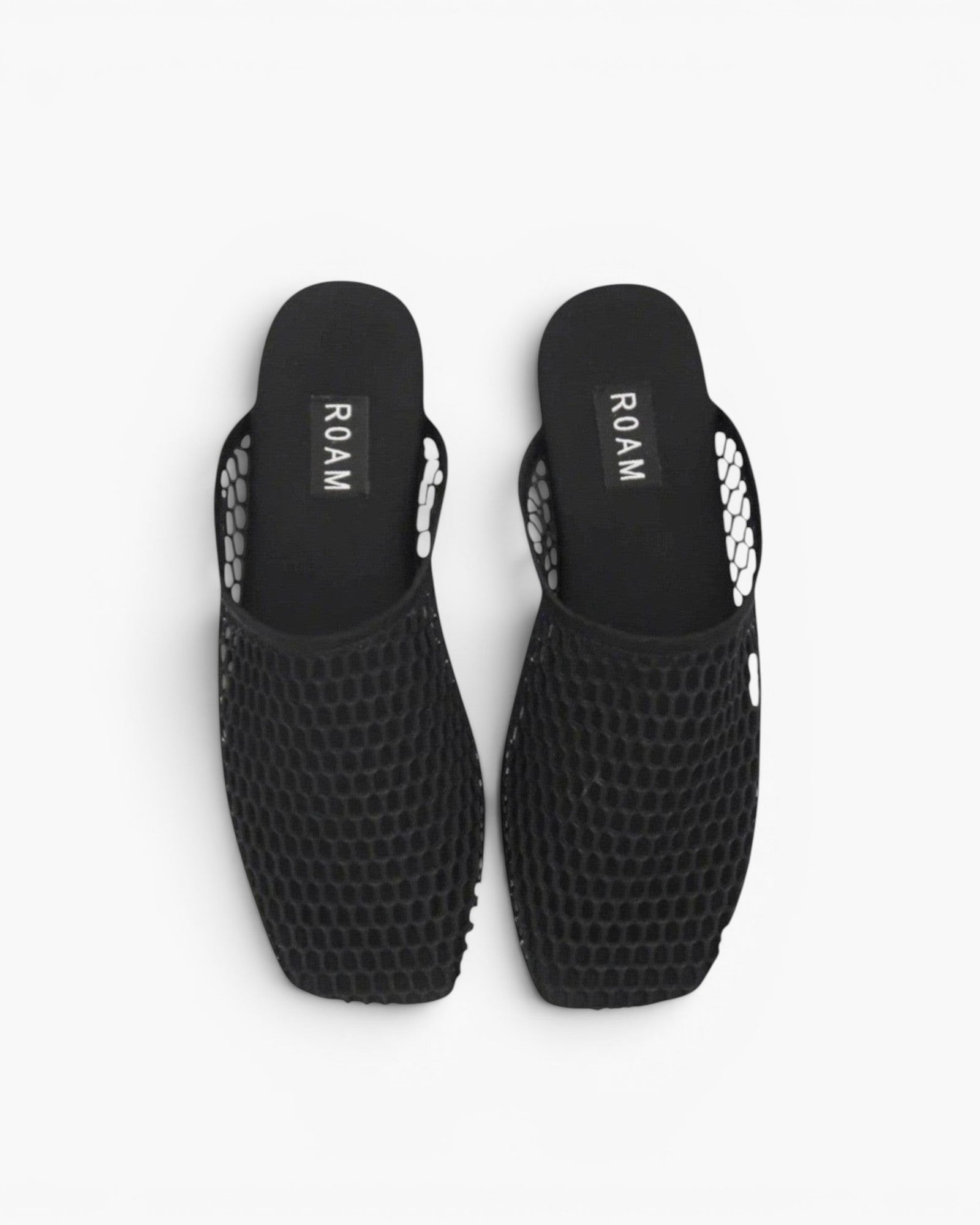 JONES + CO ROAM black mesh baboosh mules with breathable netted construction and neoprene trim.