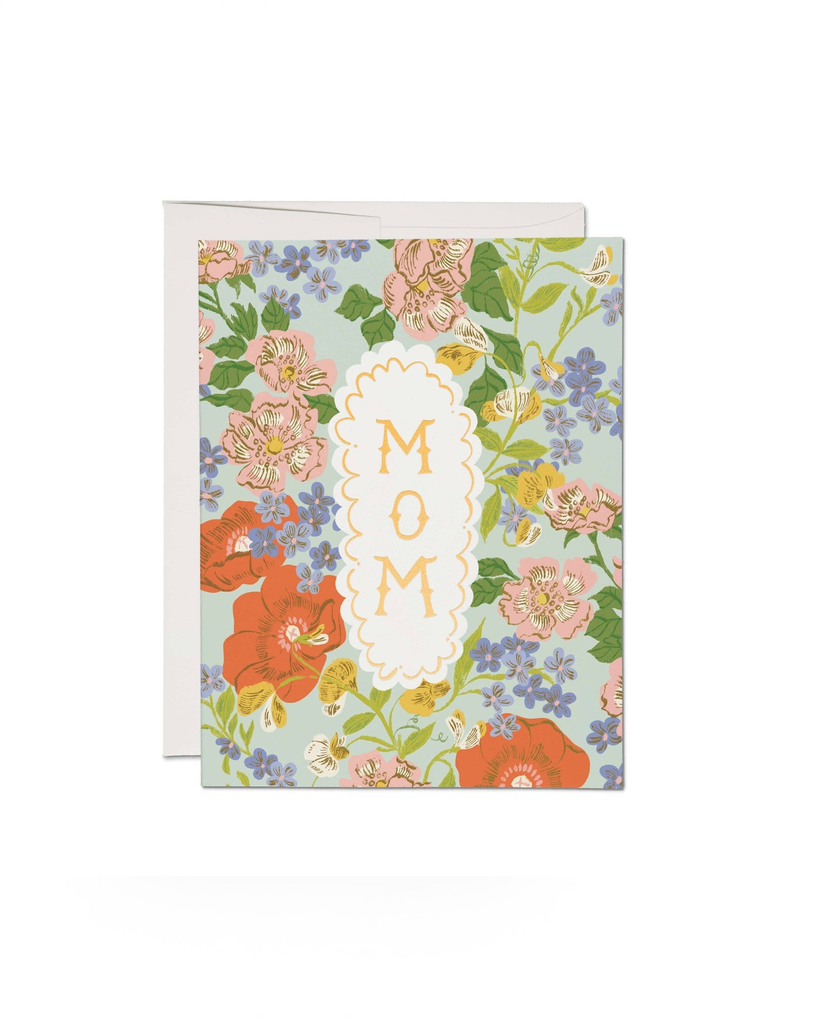 JONES + CO Blossom Serenade greeting card featuring a floral pattern with MOM text in a scalloped white frame.