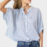 Model wearing a JONES + CO organic cotton blue indigo striped mandarin collar top with batwing sleeves.