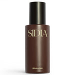 JONES + CO BRALESS body mist in a sleek dark brown bottle with minimalist gold lettering on a white background.