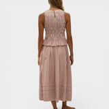 Model wearing JONES + CO Cales midi skirt in cinnamon white check cotton with elastic waist and hem pin tucks.