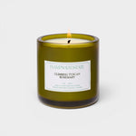 JONES + CO Climbing Tuscan Rosemary scented candle in a green glass jar with a white label.