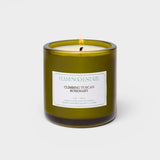 JONES + CO Climbing Tuscan Rosemary scented candle in a green glass jar with a white label.