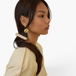 Model wearing a JONES + CO Crystal Pave Bar Barrette in a sleek, elongated design with sparkling crystals.