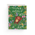JONES + CO Daydreaming Card featuring a brown bear illustration on a green floral background with hand-lettered text.