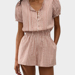 JONES + CO Emilie playsuit in cinnamon and white Paloma check with puff sleeves, button front, and elastic waist.