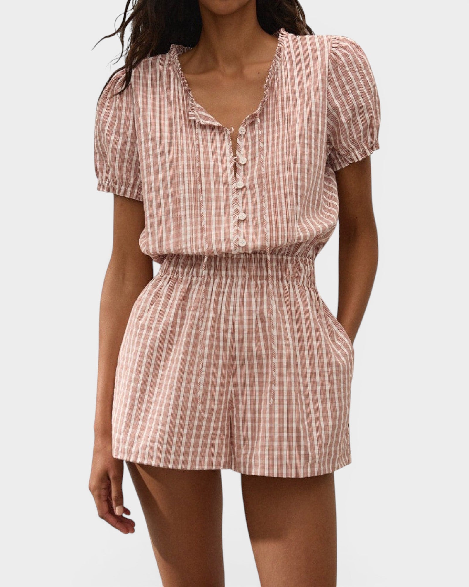 JONES + CO Emilie playsuit in cinnamon and white Paloma check with puff sleeves, button front, and elastic waist.