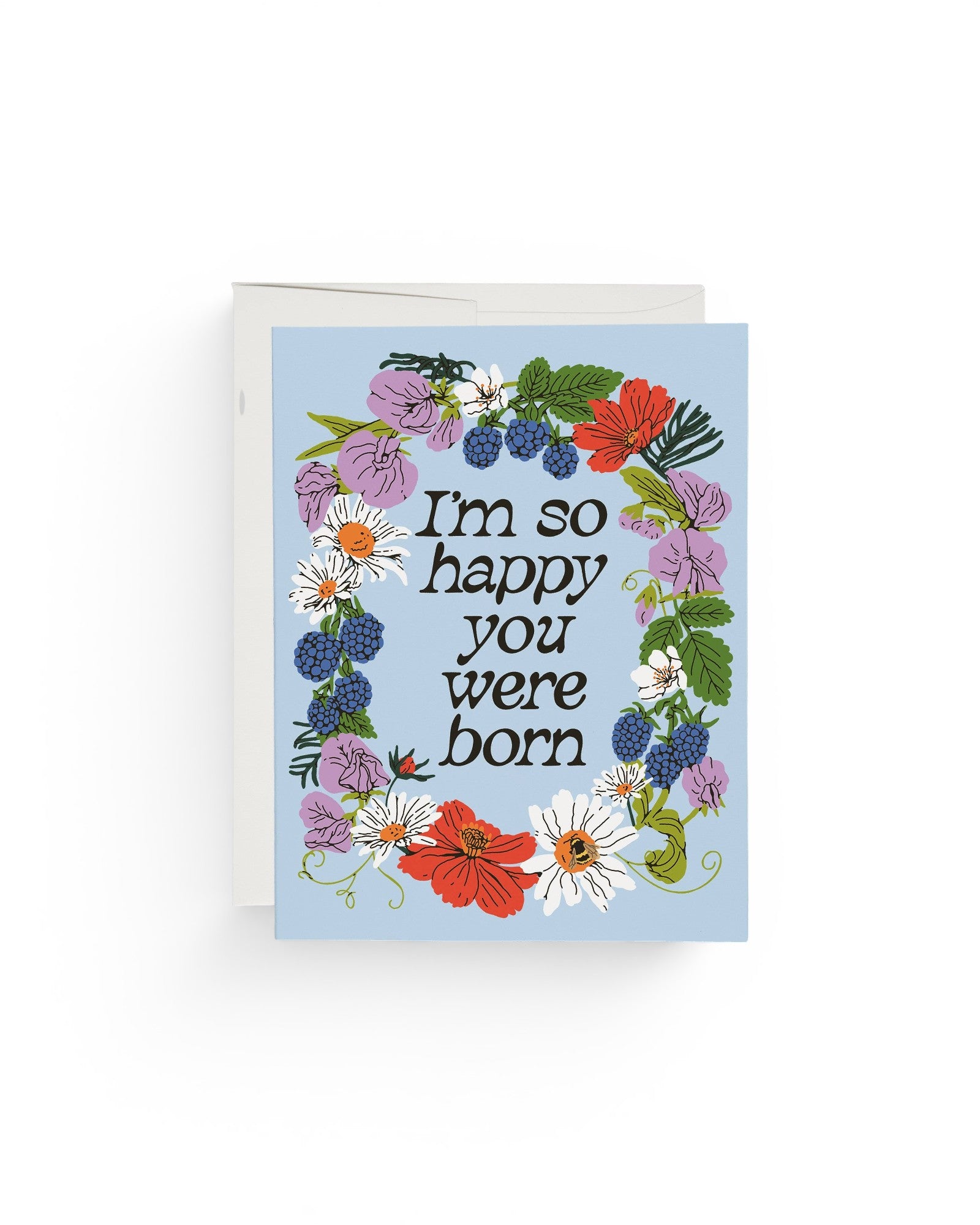 JONES + CO Full Circle greeting card with floral wreath illustration and I'm so happy you were born text on blue paper