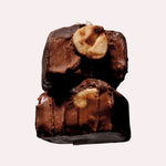JONES + CO hazelnut butter praline chocolate bar topped with a whole organic hazelnut and infused with maca root.