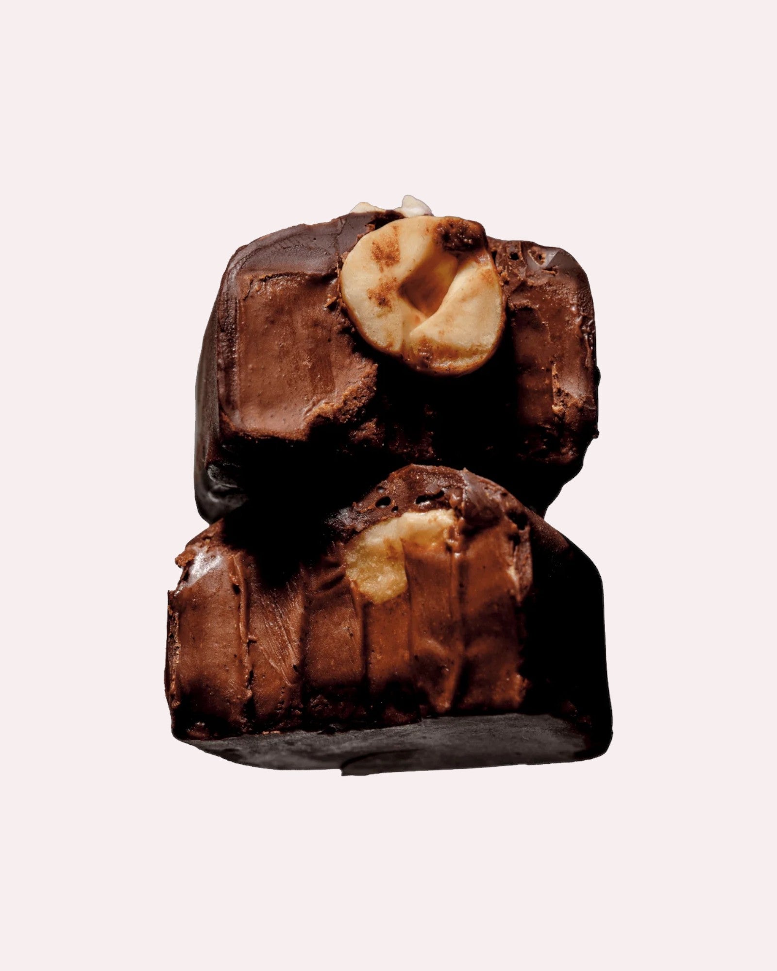 JONES + CO hazelnut butter praline chocolate bar topped with a whole organic hazelnut and infused with maca root.