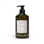 JONES + CO Heirloom Tomato hand soap in a green fluted glass bottle with a black pump dispenser.