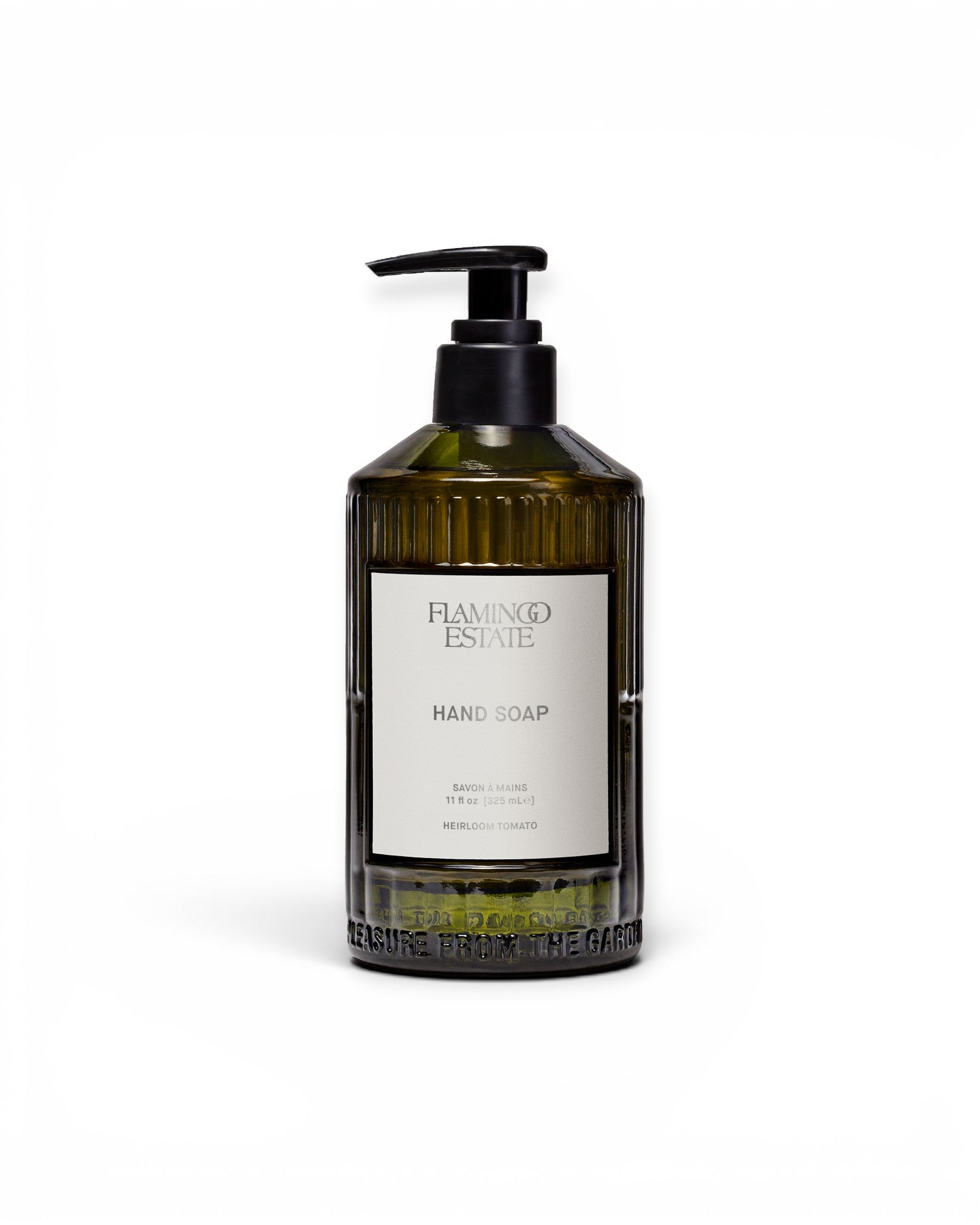 JONES + CO Heirloom Tomato hand soap in a green fluted glass bottle with a black pump dispenser.