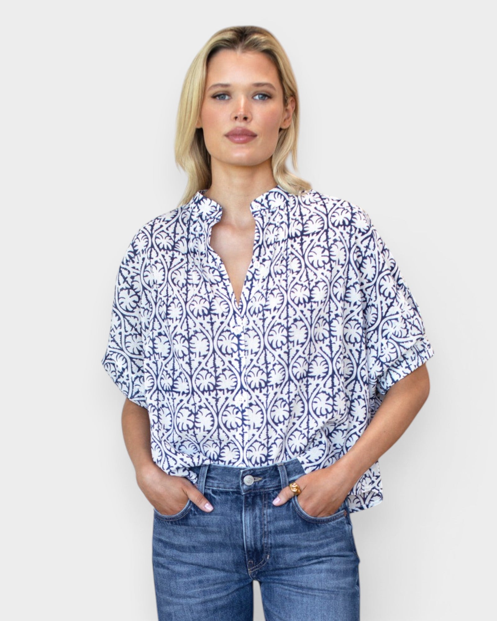Model wearing JONES + CO organic cotton button-front shirt in indigo vine print with mandarin collar and batwing sleeves