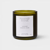JONES + CO Night Blooming Jasmine and Damask Rose scented candle in a dark olive green glass vessel.