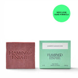 JONES + CO Jasmine & Damask Rose soap brick with embossed logo next to its mint green packaging box.