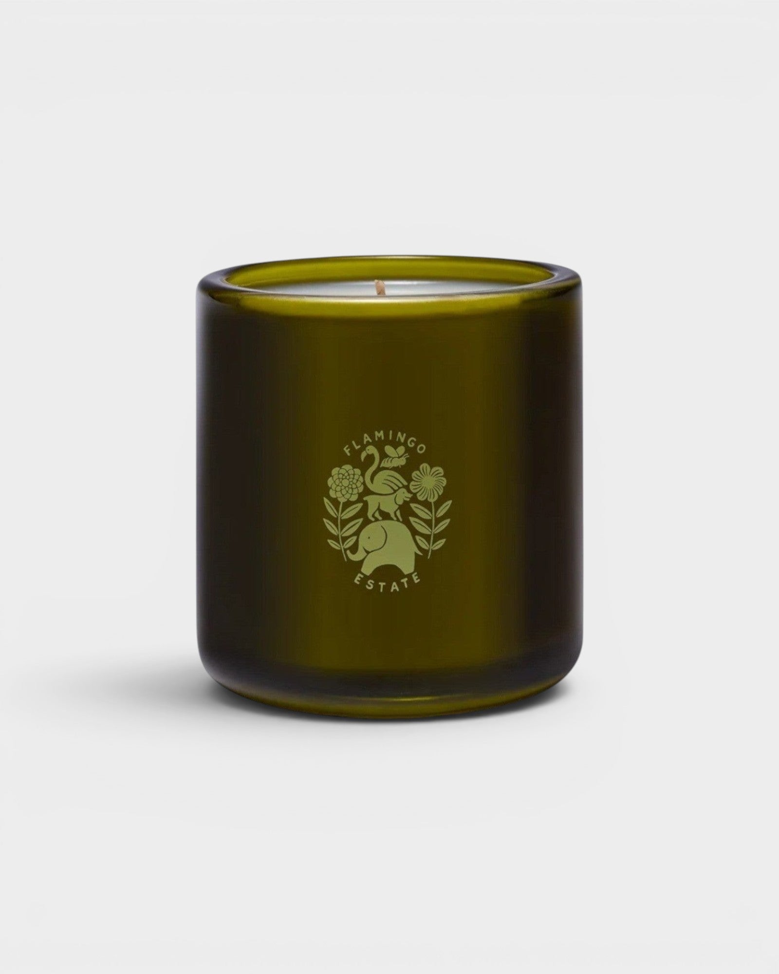 JONES + CO Night Blooming Jasmine & Damask Rose scented candle in a dark olive green glass vessel with logo.
