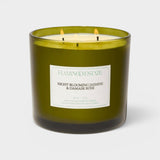 JONES + CO XL scented candle in a green glass jar with Night Blooming Jasmine and Damask Rose fragrance notes.