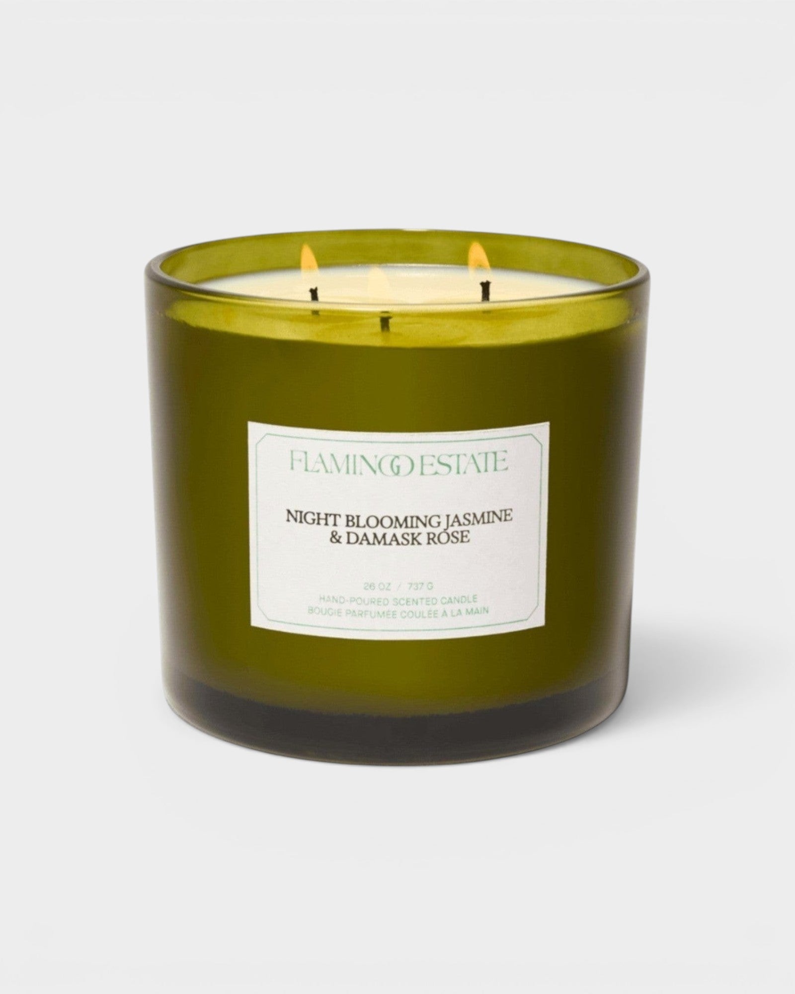JONES + CO XL scented candle in a green glass jar with Night Blooming Jasmine and Damask Rose fragrance notes.