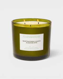 JONES + CO XL scented candle in a green glass jar with Night Blooming Jasmine and Damask Rose fragrance notes.