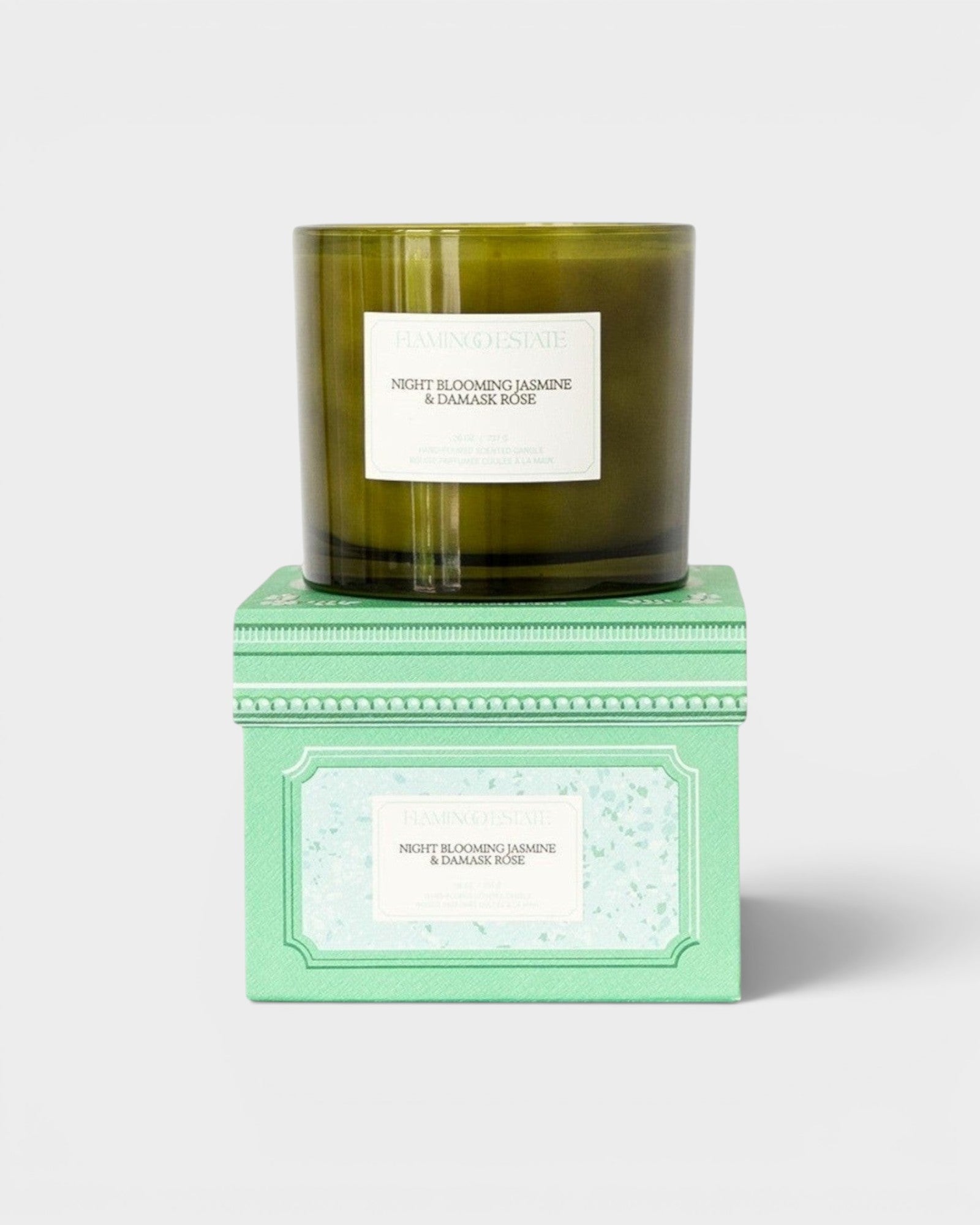 JONES + CO Night Blooming Jasmine & Damask Rose XL candle in a dark green glass jar with a decorative mint green box.