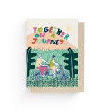 JONES + CO Journey Together greeting card featuring a colorful illustration of a couple riding a tandem bicycle.
