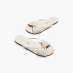 JONES + CO Lily cream leather flip flop sandals featuring an oversized bow detail and cushioned insole.