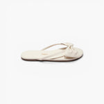 JONES + CO Lily cream leather flip flop sandal featuring an oversized bow detail and cushioned insole.