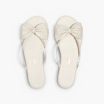 JONES + CO Lily cream leather flip flop sandals featuring an oversized bow detail and cushioned insole.
