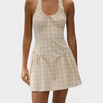 JONES + CO Lola mini dress in antique white with a blue check pattern, featuring a halter neck and drop waist.