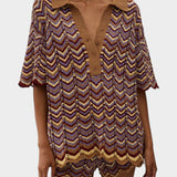 JONES + CO Luis Polo Top in Ramona stripe featuring a chevron knit pattern with brown, yellow, and purple tones.