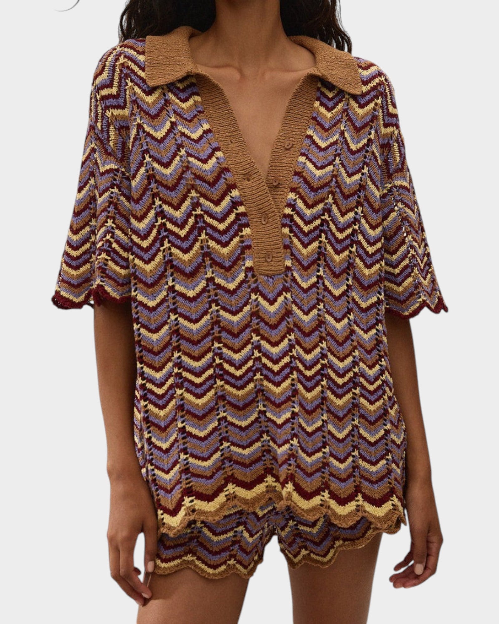 JONES + CO Luis Polo Top in Ramona stripe featuring a chevron knit pattern with brown, yellow, and purple tones.
