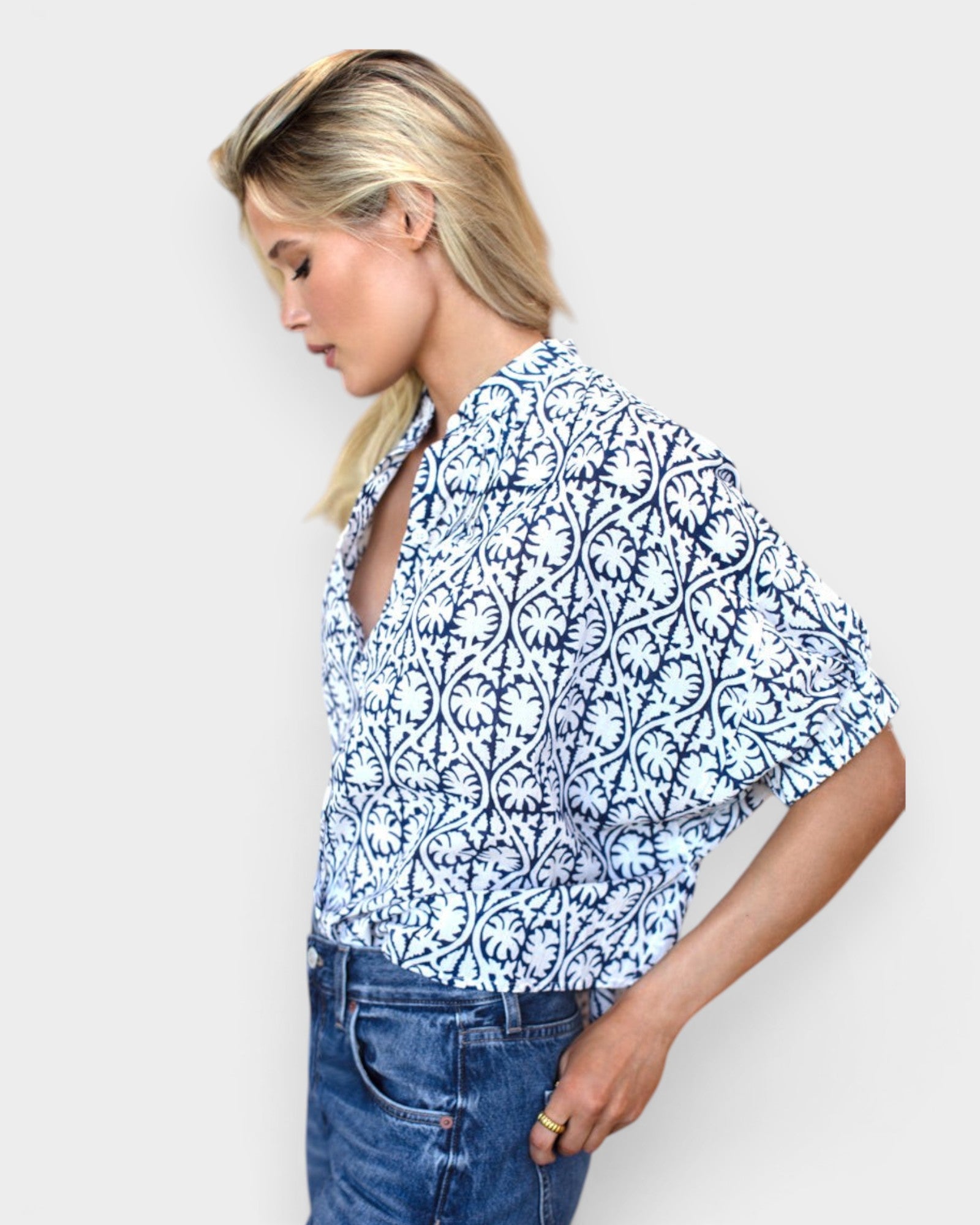 Model wearing JONES + CO organic cotton button-front shirt in indigo vine print with mandarin collar and batwing sleeves