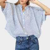 Model wearing a JONES + CO organic cotton blue indigo striped top with mandarin collar and batwing sleeves.