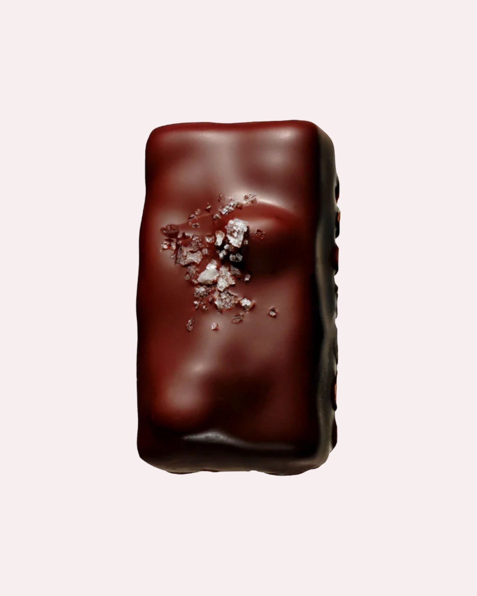 JONES + CO dark chocolate caramel bar topped with Tasmanian sea salt and maple roasted macadamias