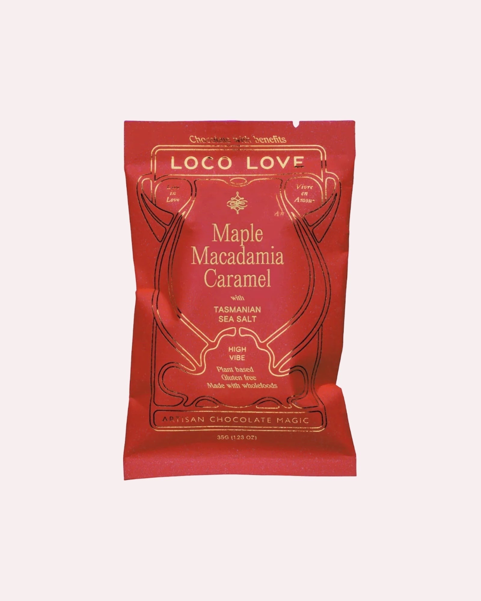 JONES + CO Loco Love Maple Macadamia Caramel dark chocolate bar in a red wrapper with gold lettering.