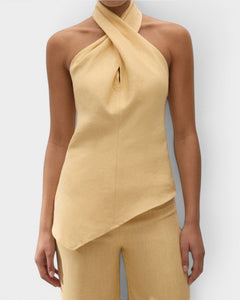 JONES + CO Maria Top in daffodil yellow linen with a halter neck, cross-front detail, and asymmetrical hemline.