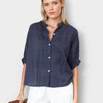 Model wearing JONES + CO midnight blue organic cotton seersucker button-front top with a mandarin collar.