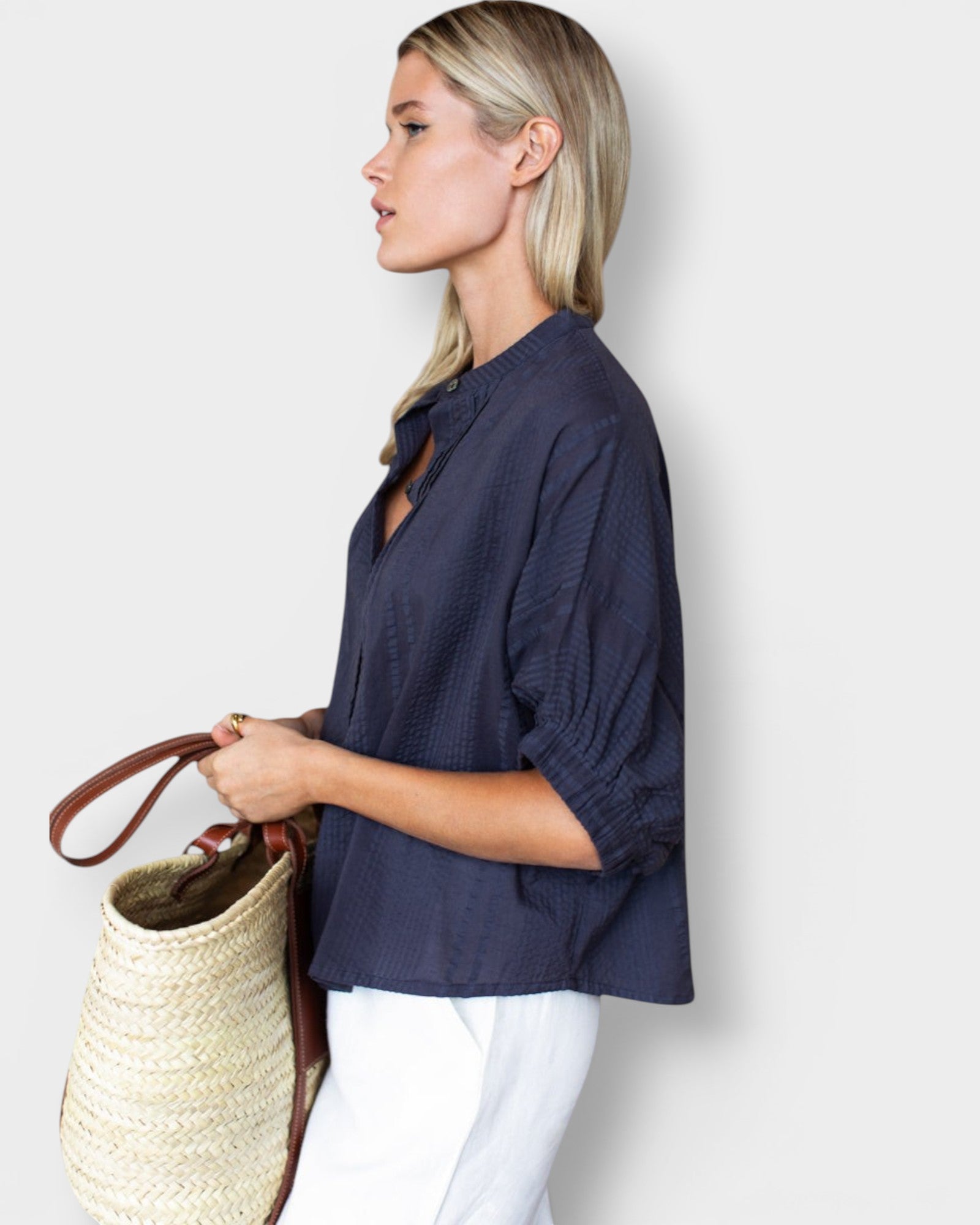 JONES + CO midnight blue organic cotton seersucker mandarin collar top with a relaxed fit worn by a blonde model.