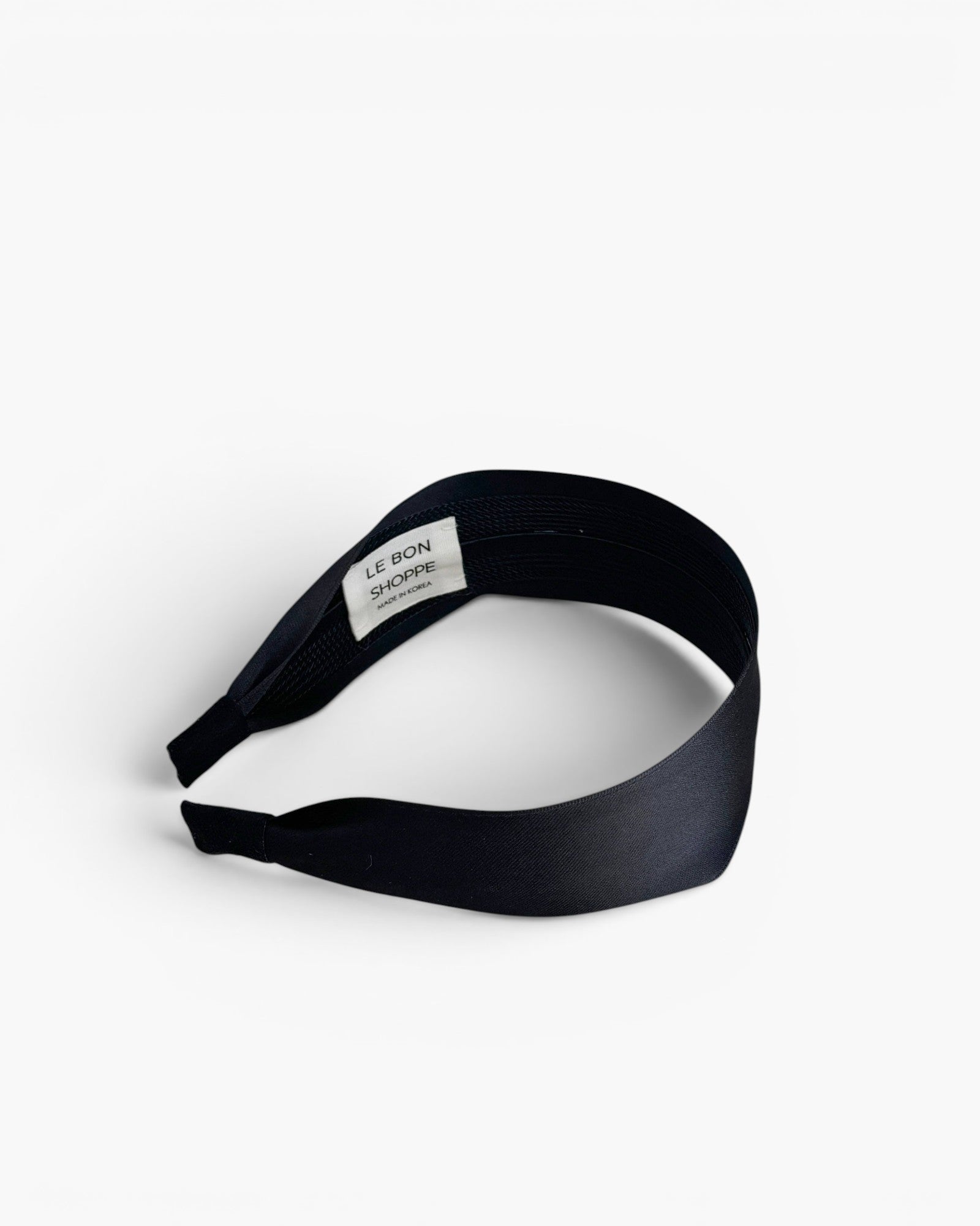 JONES + CO Olivia Headband in ebony black with a flexible design and comfortable fabric finish.