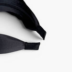 JONES + CO Olivia headband in ebony black with a smooth fabric finish and comfortable suede-tipped ends.